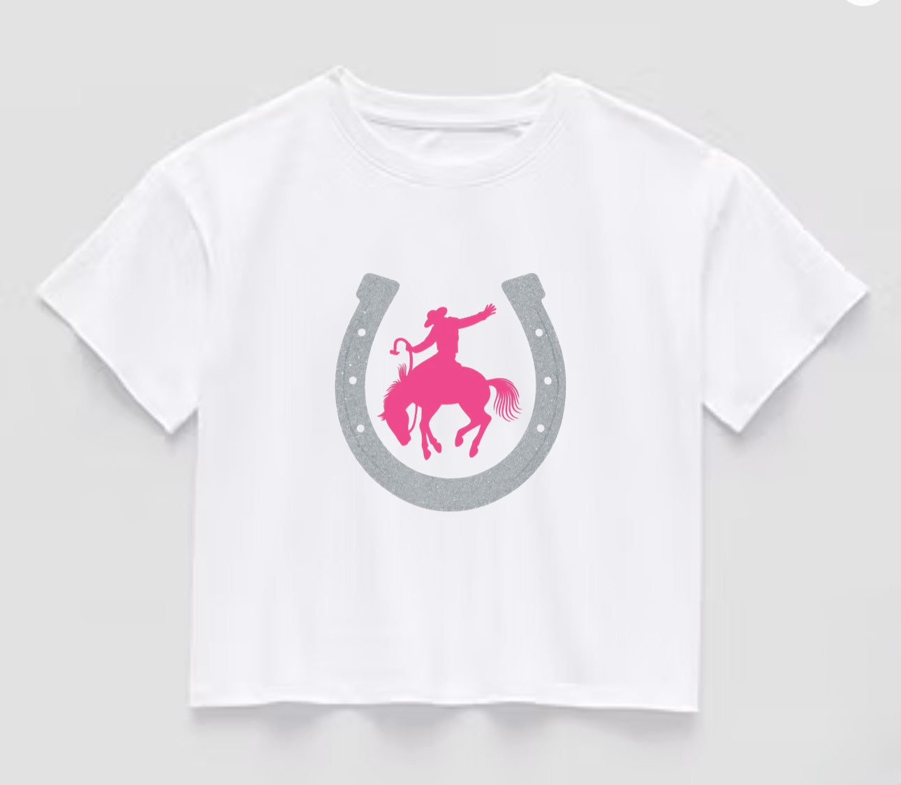“If It Bucks, I’m In” Rodeo Crop Tee – Glitter & Grit Edition